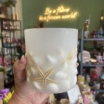 Στρογγυλό φωτοφόρο κερί με κοχύλια και αστερία